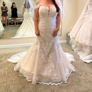 Wedding Dress. Blush color, lace overlay, corset bodice. Removable sleeve.